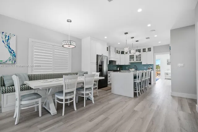 a kitchen with stainless steel appliances granite countertop a stove and a sink