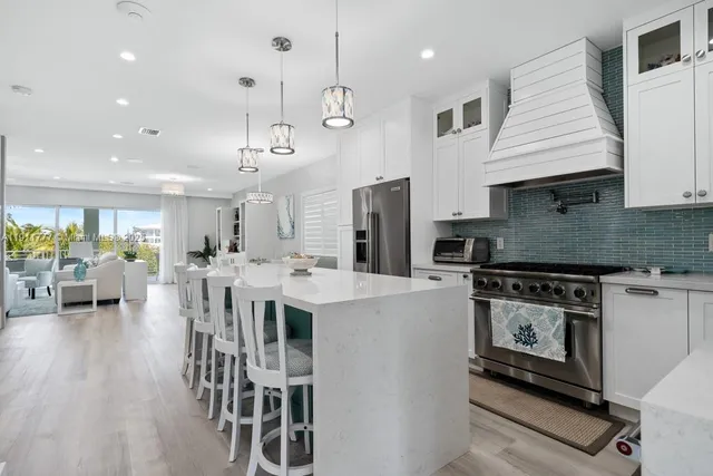 a kitchen with a sink and a stove top oven