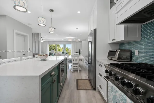 a bathroom with a sink mirror toilet and shower