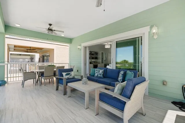 a view of a hallway with wooden floor and entryway