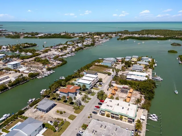 a front view of a building with a garden