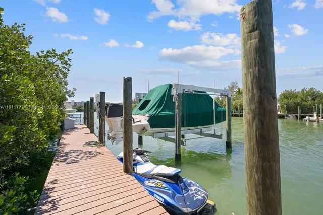 a view of a patio with couches table and chairs and potted plants