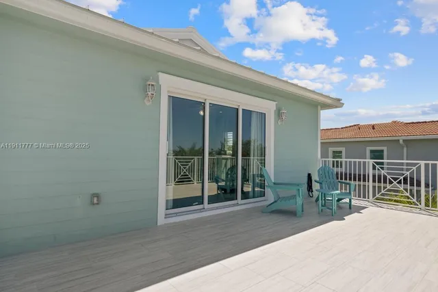 a spacious bedroom with a bed and a couch