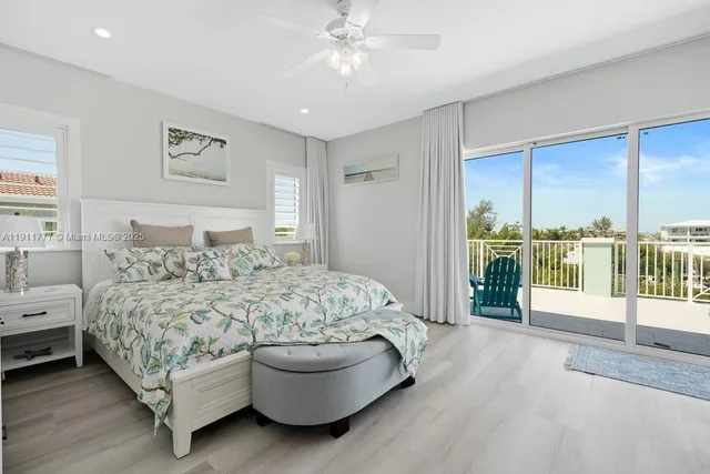 a bathroom with a granite countertop toilet sink and mirror