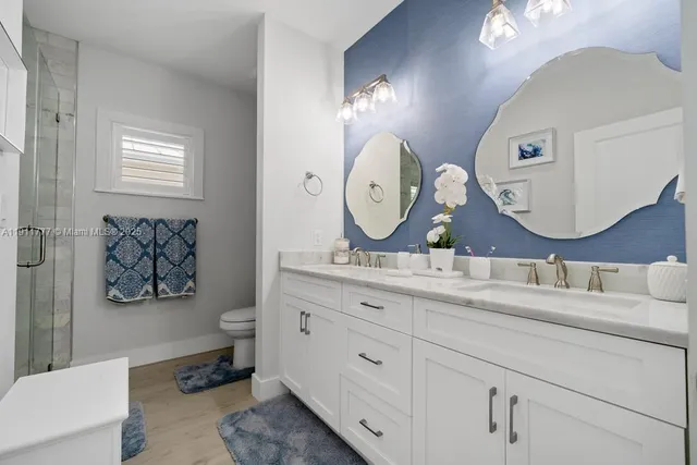 a view of a dining room with furniture wooden floor and a chandelier