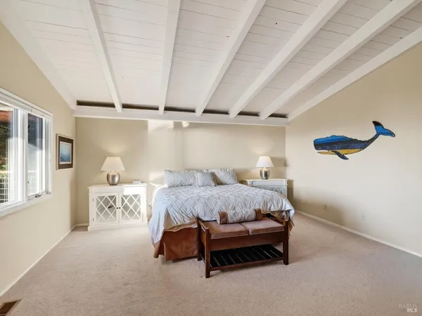 a bedroom with a bed and a table