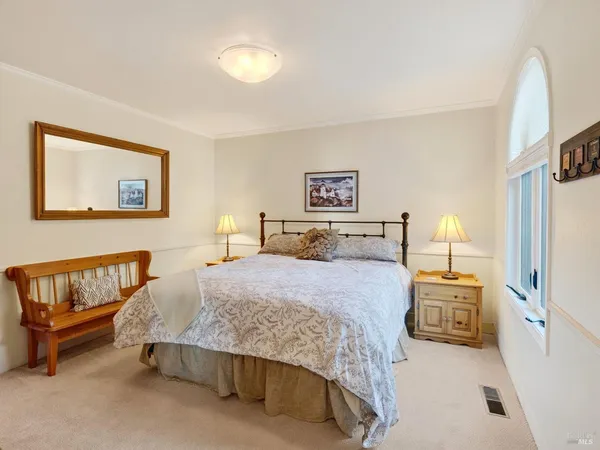 a bedroom with a bed and a couch