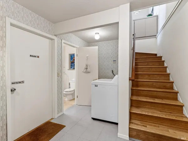 a view of bathroom with a sink and mirror