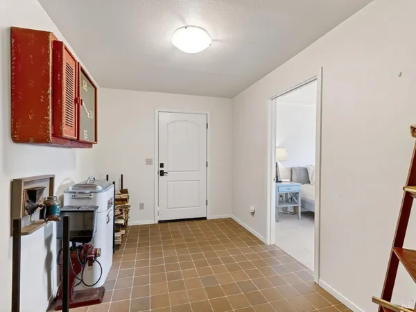 a view of a storage & utility room with two washing machine