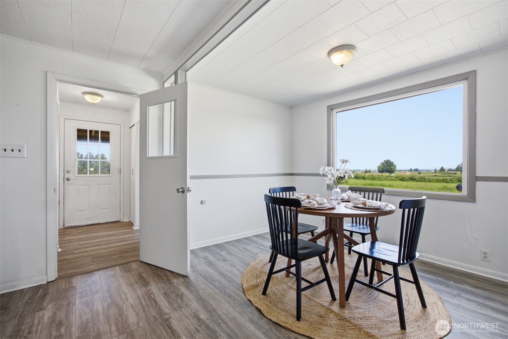 6791 Noon Road Everson, WA 98247 - Photo 15 of 38 a view of a dining room with furniture window and wooden floor