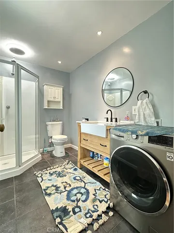 a living room with a couch and a table with wooden floor