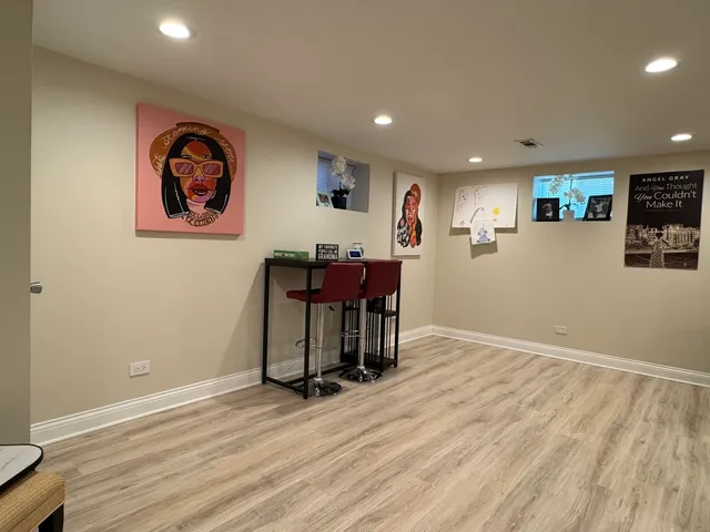 an empty room with furniture and wooden floor