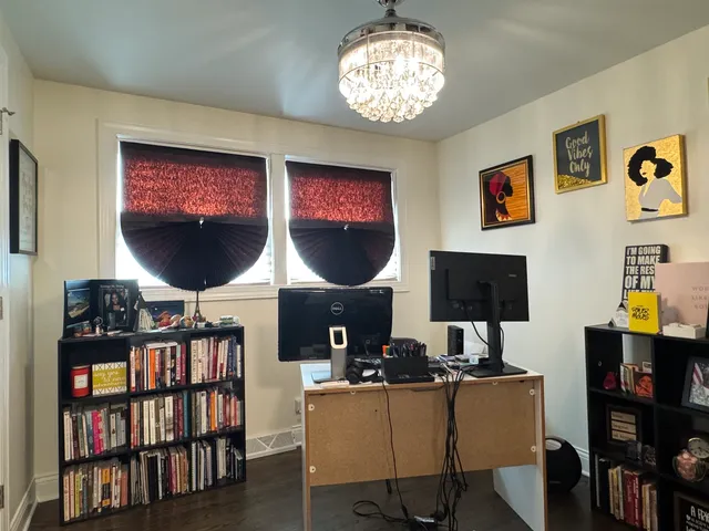 a view of a livingroom with furniture and a flat screen tv
