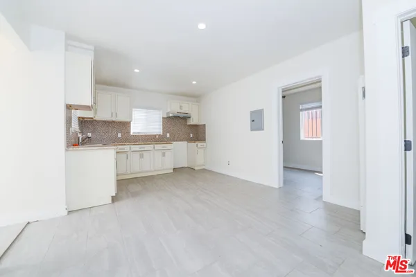a view of a kitchen with a sink
