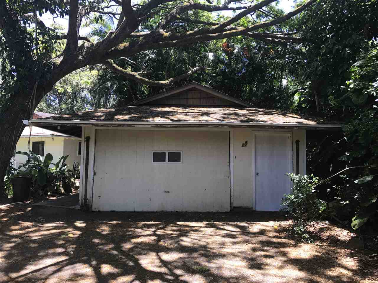 1825 Haiku Road Haiku, HI 96708 - Photo 19 of 24 a house with a tree in front of it