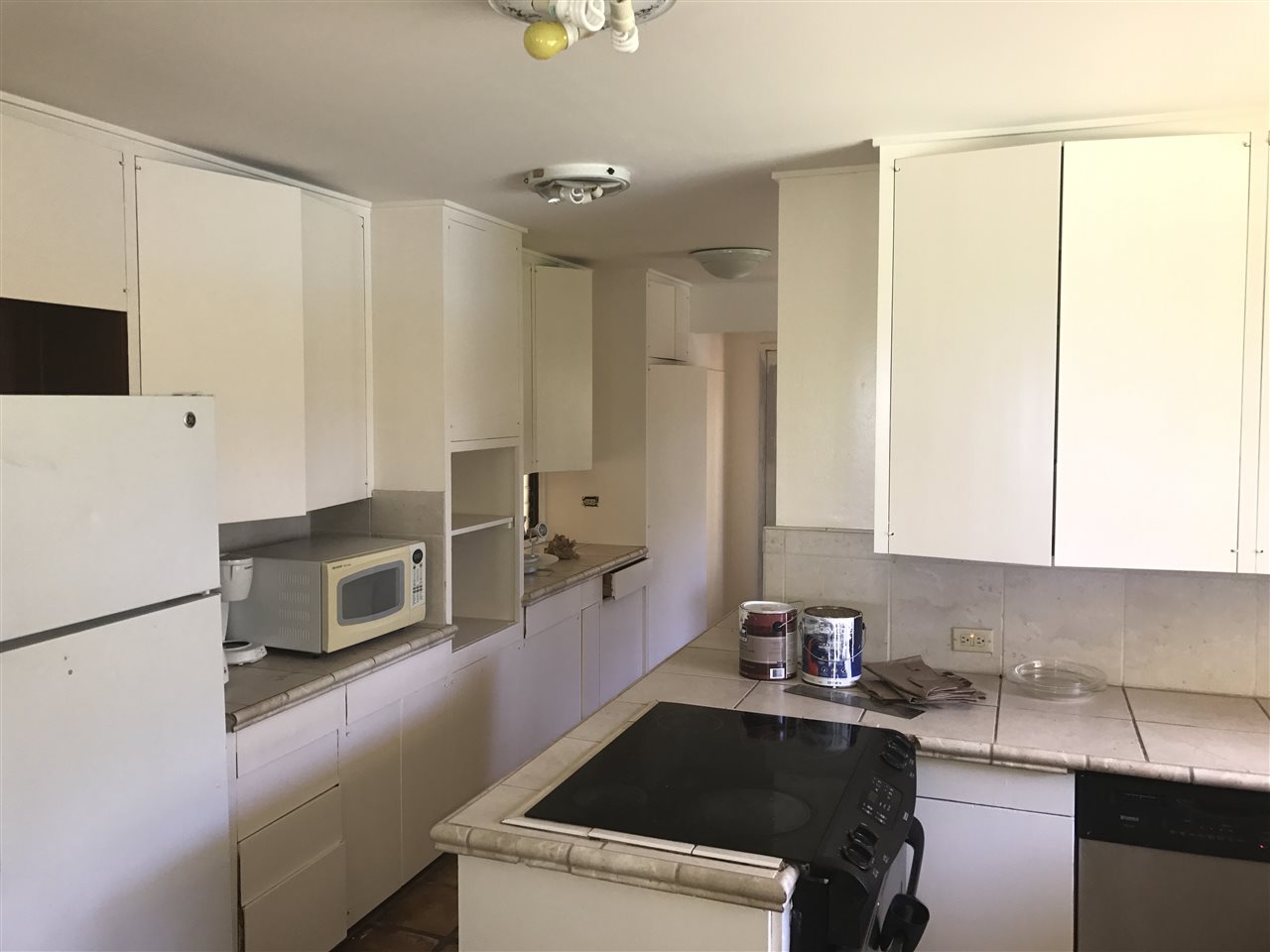 1825 Haiku Road Haiku, HI 96708 - Photo 8 of 24 a kitchen with a sink a stove and a microwave
