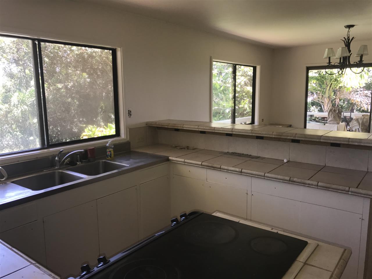 1825 Haiku Road Haiku, HI 96708 - Photo 10 of 24 a kitchen with a sink and large window