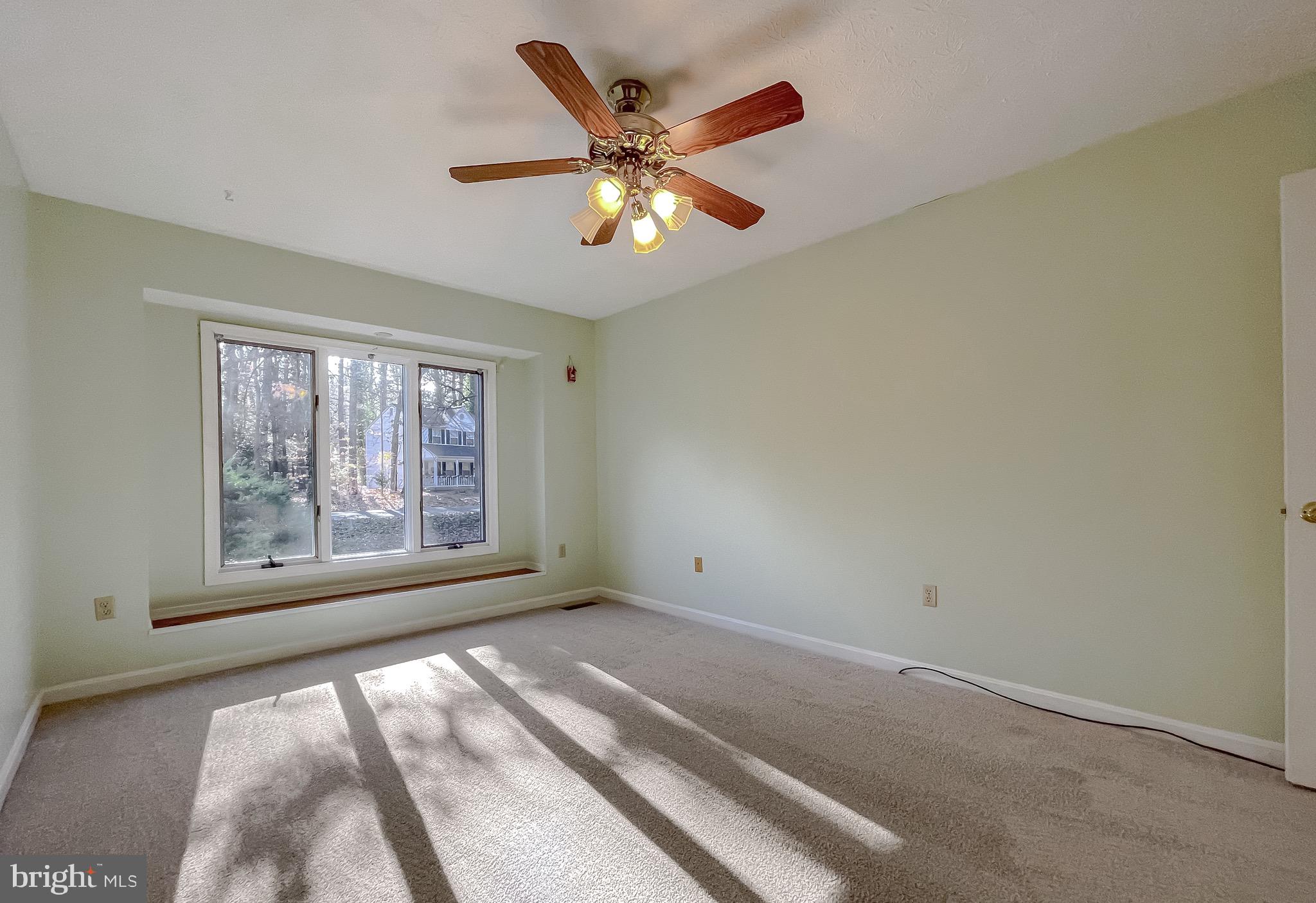 288 Elkins Lane Lusby, MD 20657 - Photo 18 of 73 an empty room with a ceiling fan and window