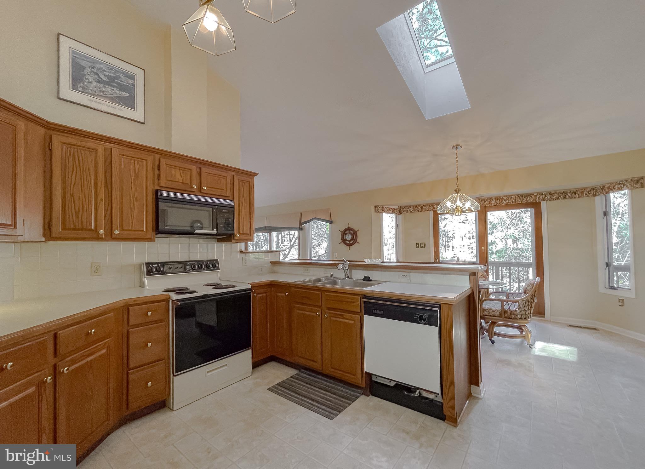 288 Elkins Lane Lusby, MD 20657 - Photo 37 of 73 a kitchen with cabinets a sink and appliances
