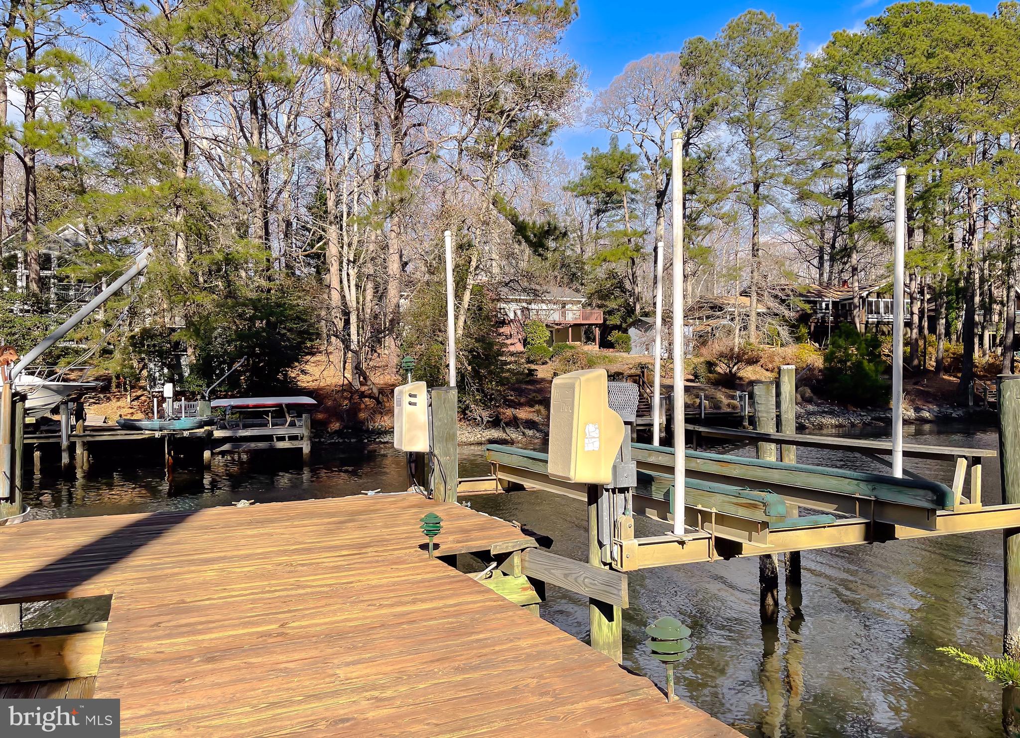 288 Elkins Lane Lusby, MD 20657 - Photo 56 of 73 a view of a swimming pool with a patio and a yard