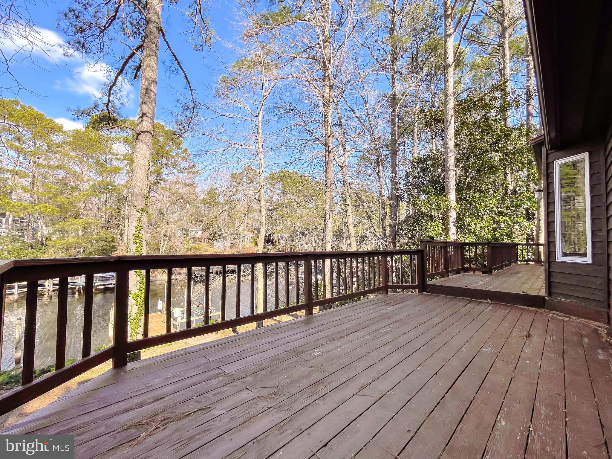 288 Elkins Lane Lusby, MD 20657 - Photo 63 of 73 a view of a balcony with wooden floor and fence