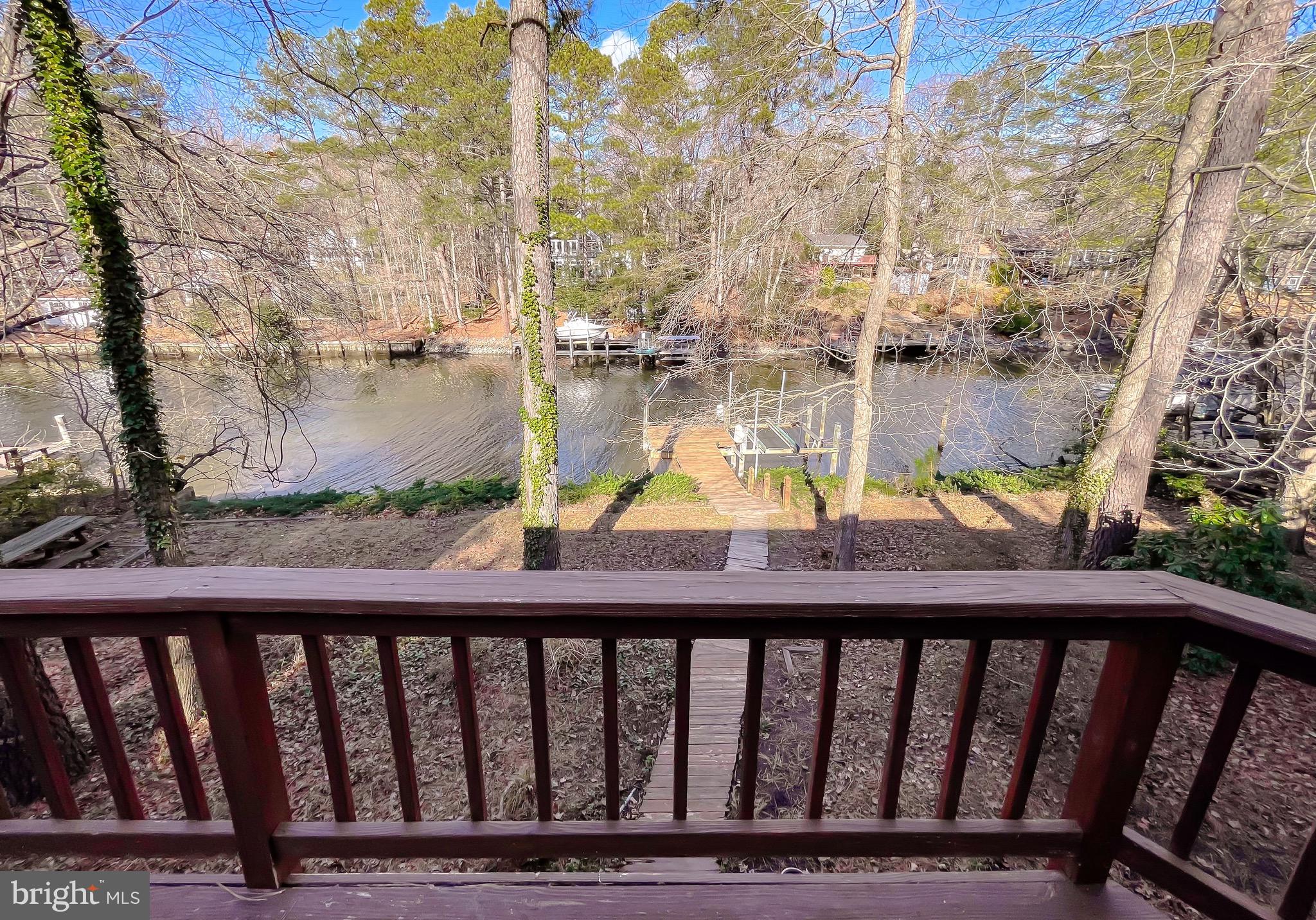 288 Elkins Lane Lusby, MD 20657 - Photo 64 of 73 a view of a balcony with wooden fence