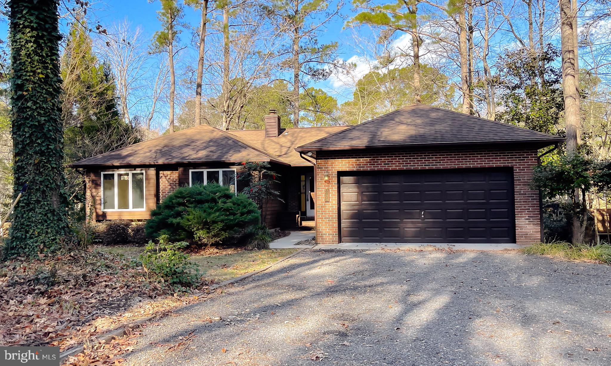 288 Elkins Lane Lusby, MD 20657 - Photo 67 of 73 a front view of a house with yard and parking