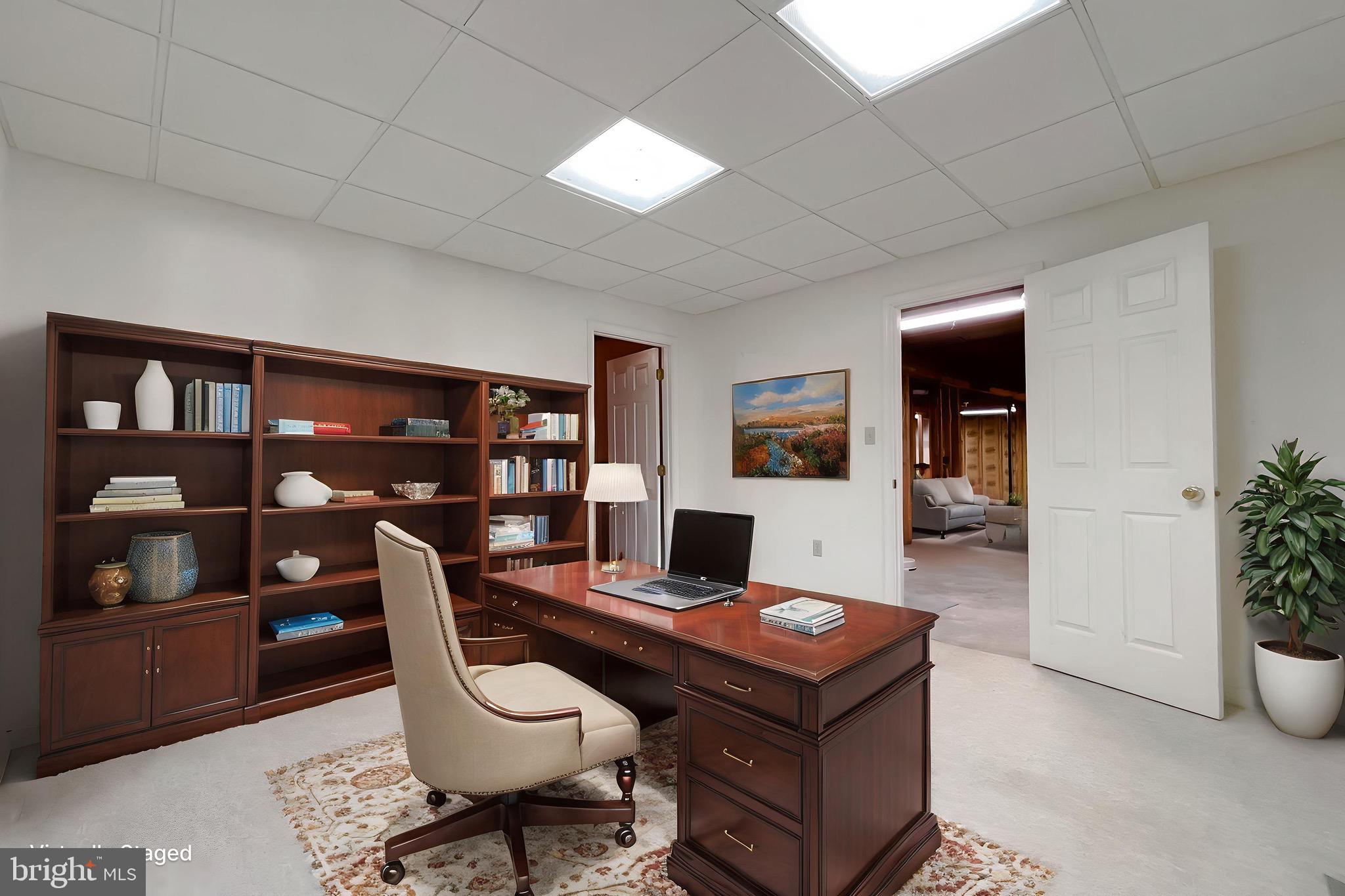 288 Elkins Lane Lusby, MD 20657 - Photo 71 of 73 a living room with furniture and a bookshelf