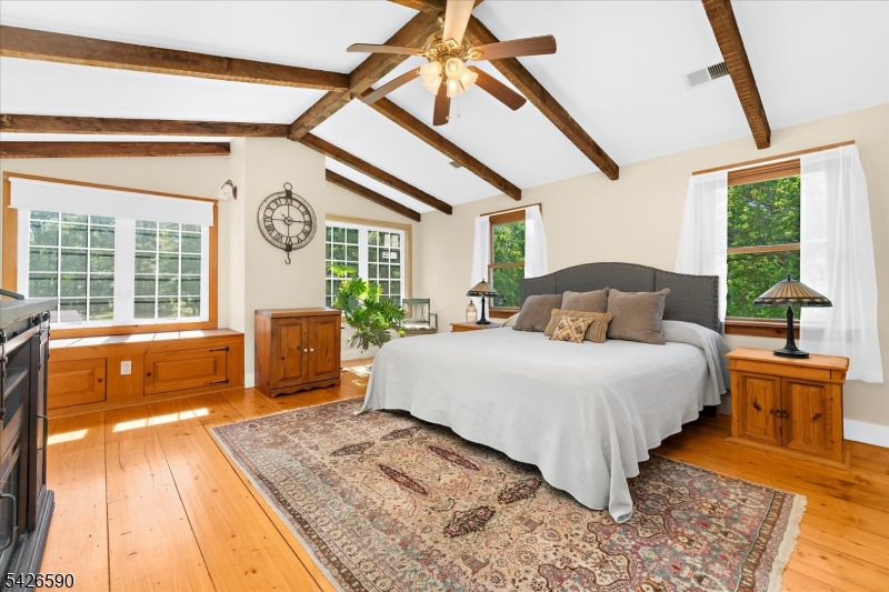179 Lindbergh Road Hopewell, NJ 08525 - Photo 24 of 46 a bed sitting in a bedroom next to a window