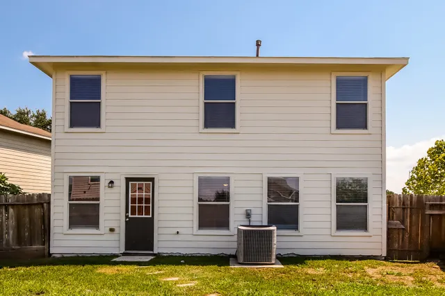 a swimming pool with outdoor seating