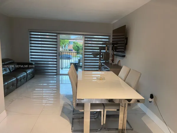 a view of a dining room with furniture