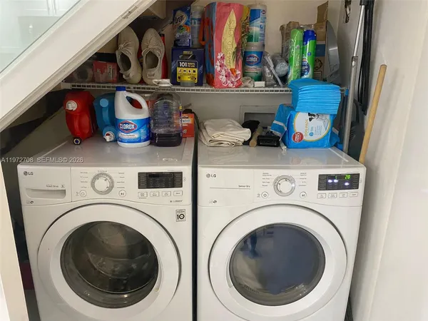 a utility room with dryer and washer