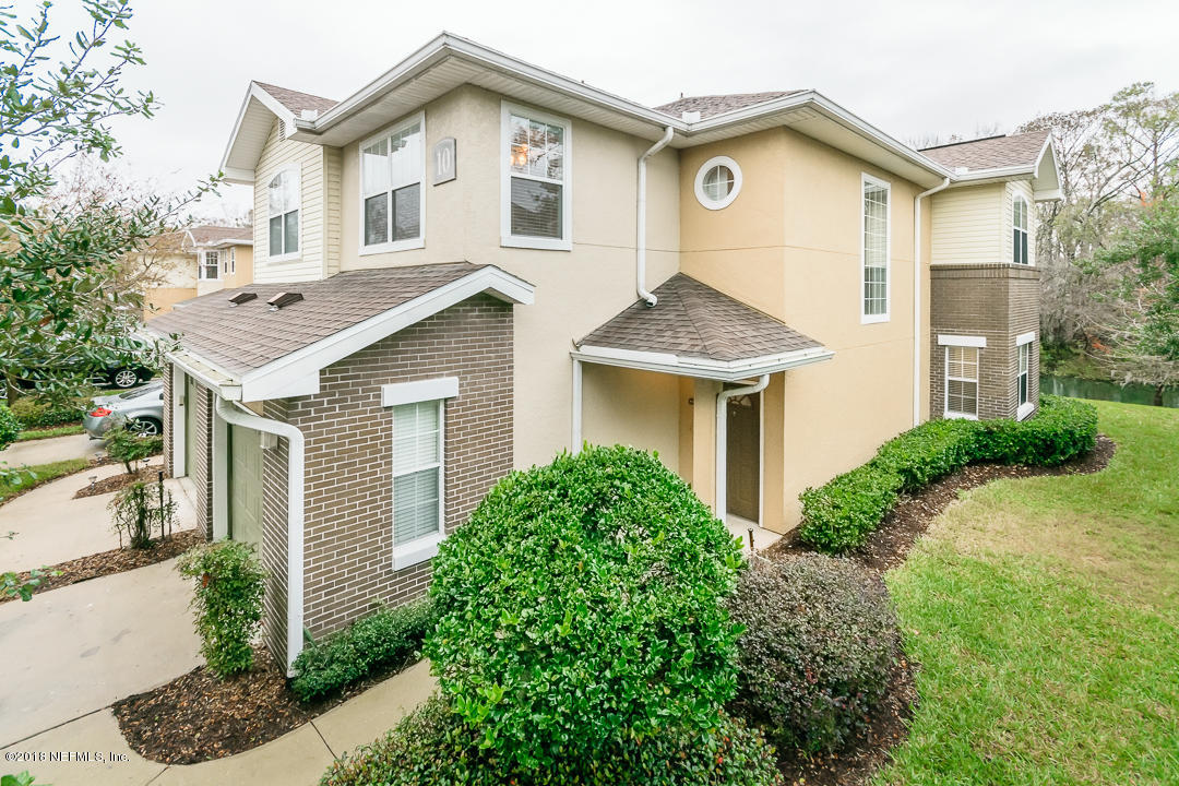 5663 Greenland Road, Unit 1008 Jacksonville, FL 32258 - Photo 1 of 24 a front view of a house with garden