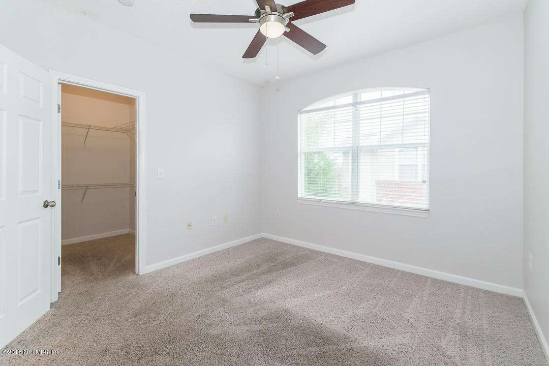 5663 Greenland Road, Unit 1008 Jacksonville, FL 32258 - Photo 16 of 24 an empty room with a window and a fan