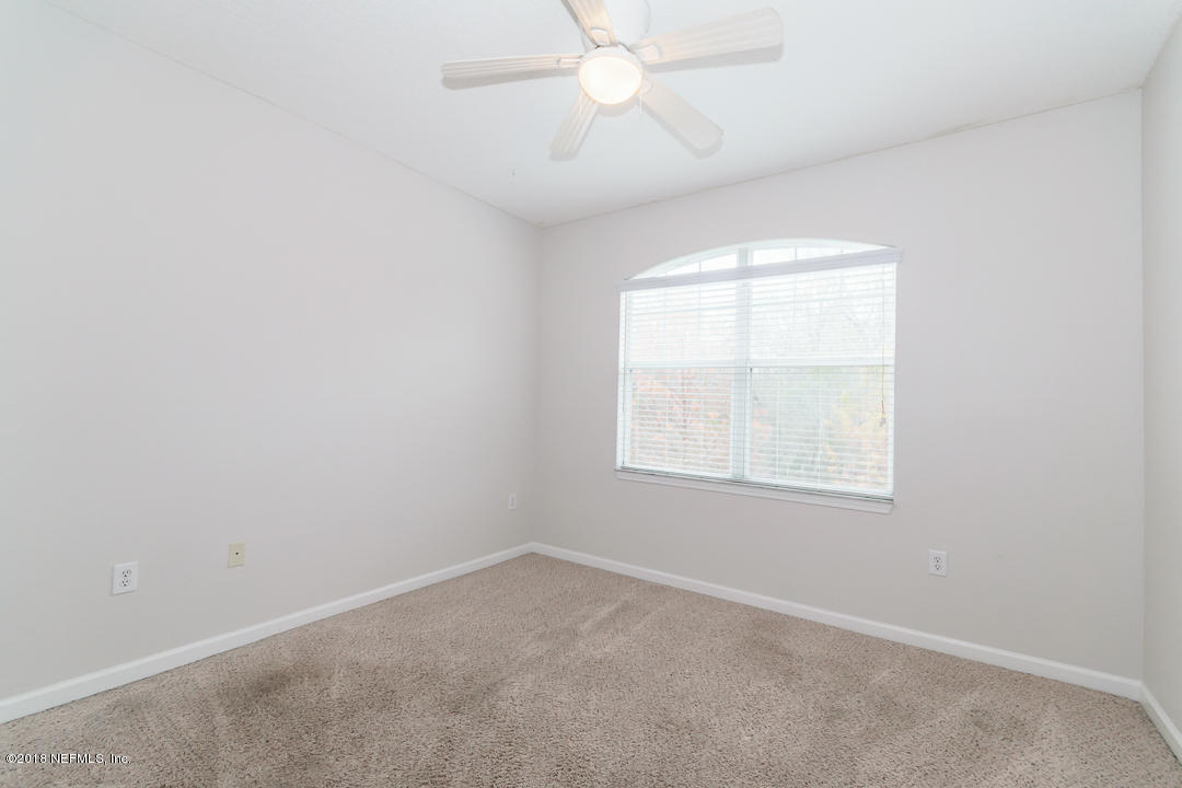5663 Greenland Road, Unit 1008 Jacksonville, FL 32258 - Photo 17 of 24 an empty room with a window and a fan
