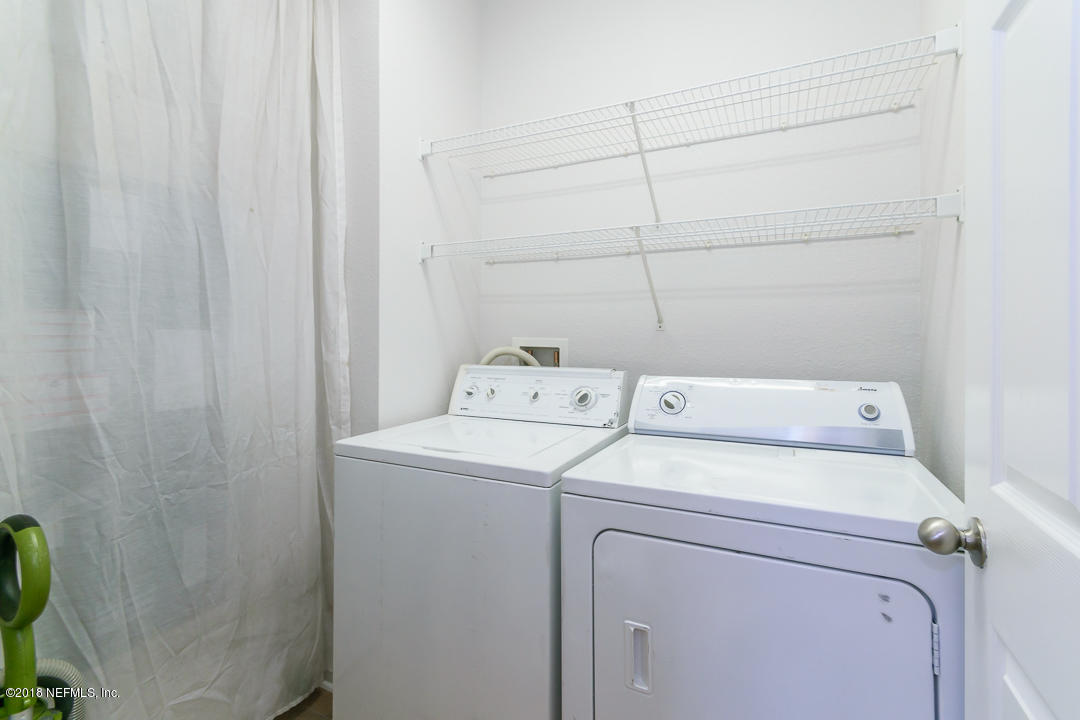 5663 Greenland Road, Unit 1008 Jacksonville, FL 32258 - Photo 19 of 24 a utility room with dryer and washer