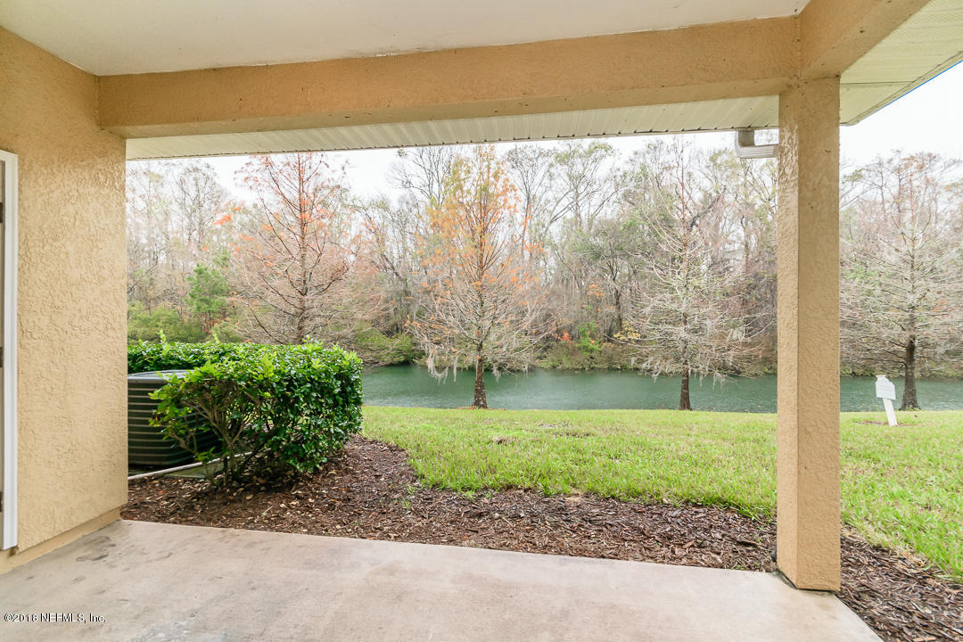 5663 Greenland Road, Unit 1008 Jacksonville, FL 32258 - Photo 20 of 24 a view of a garden with a large tree