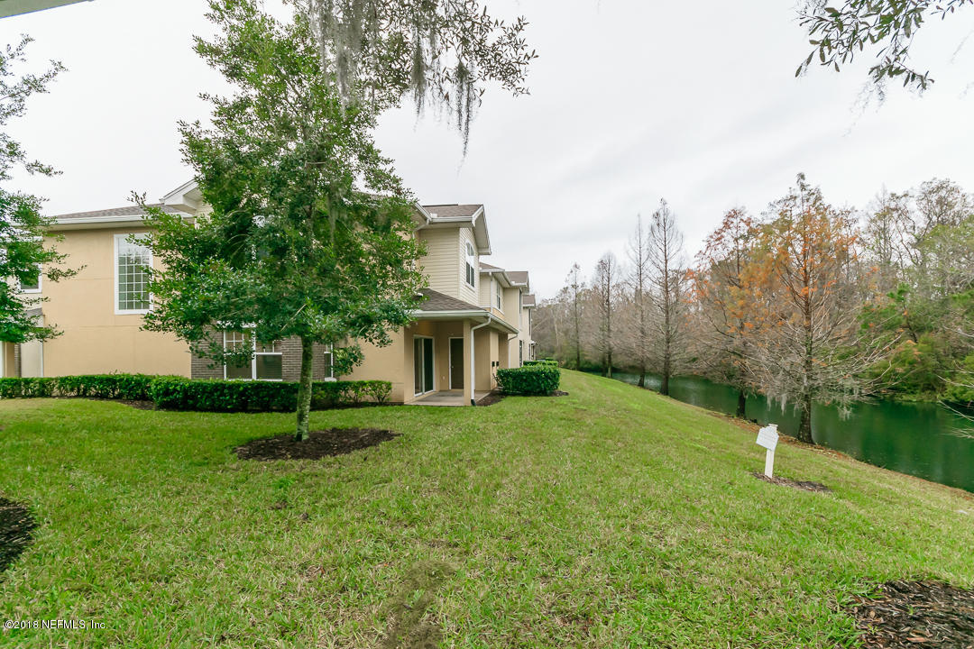 5663 Greenland Road, Unit 1008 Jacksonville, FL 32258 - Photo 21 of 24 a view of backyard of house with green space
