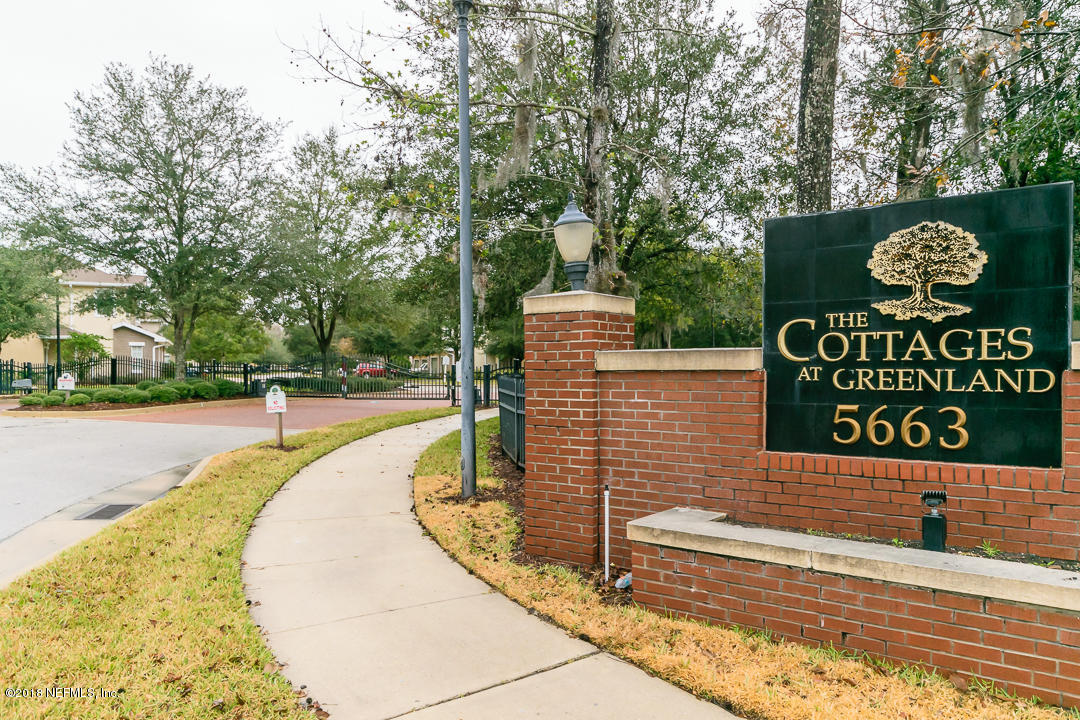 5663 Greenland Road, Unit 1008 Jacksonville, FL 32258 - Photo 24 of 24 a sign board with buildings in the background