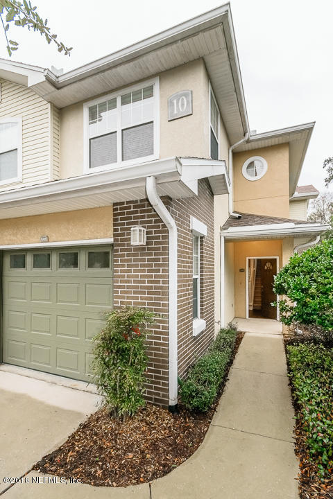 5663 Greenland Road, Unit 1008 Jacksonville, FL 32258 - Photo 3 of 24 a front view of a house with garden