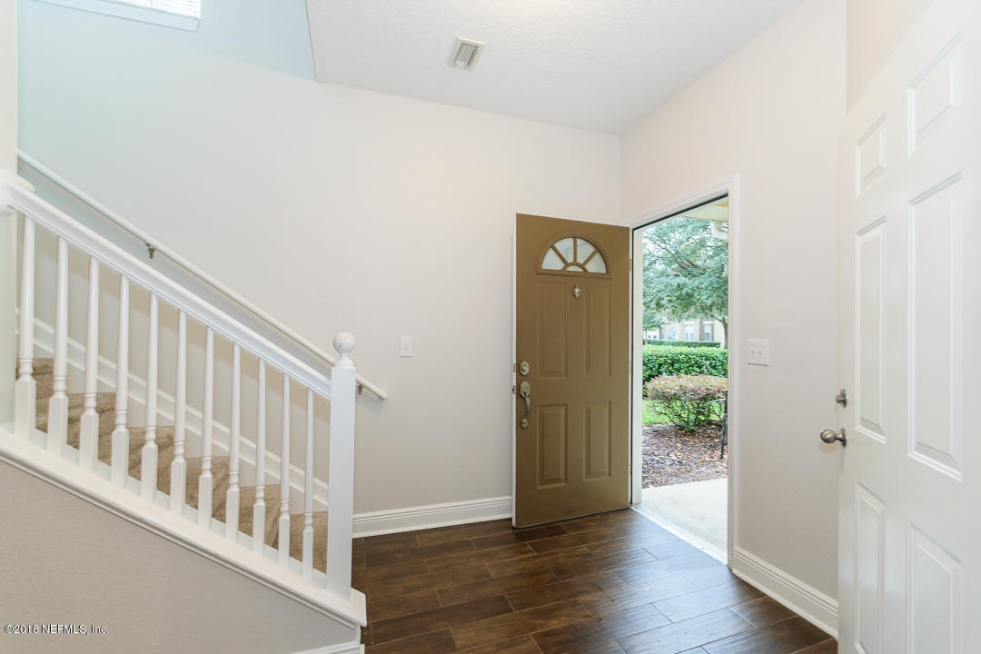 5663 Greenland Road, Unit 1008 Jacksonville, FL 32258 - Photo 4 of 24 a view of an entryway with wooden floor