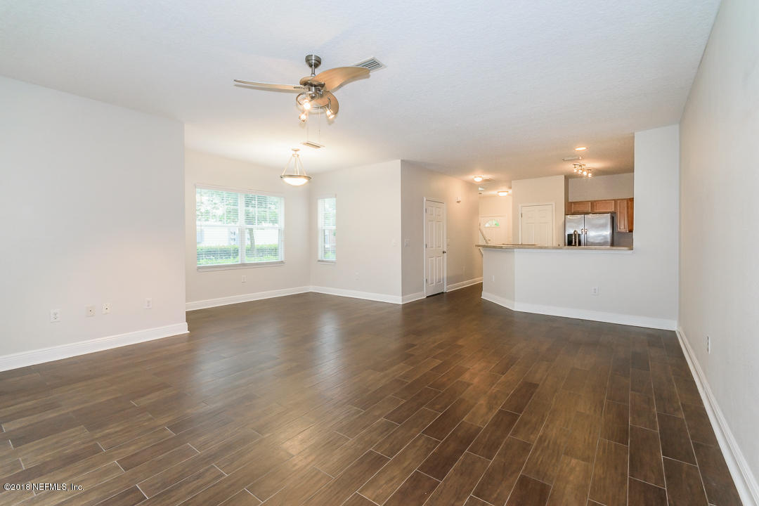 5663 Greenland Road, Unit 1008 Jacksonville, FL 32258 - Photo 7 of 24 a view of a room with wooden floor and window