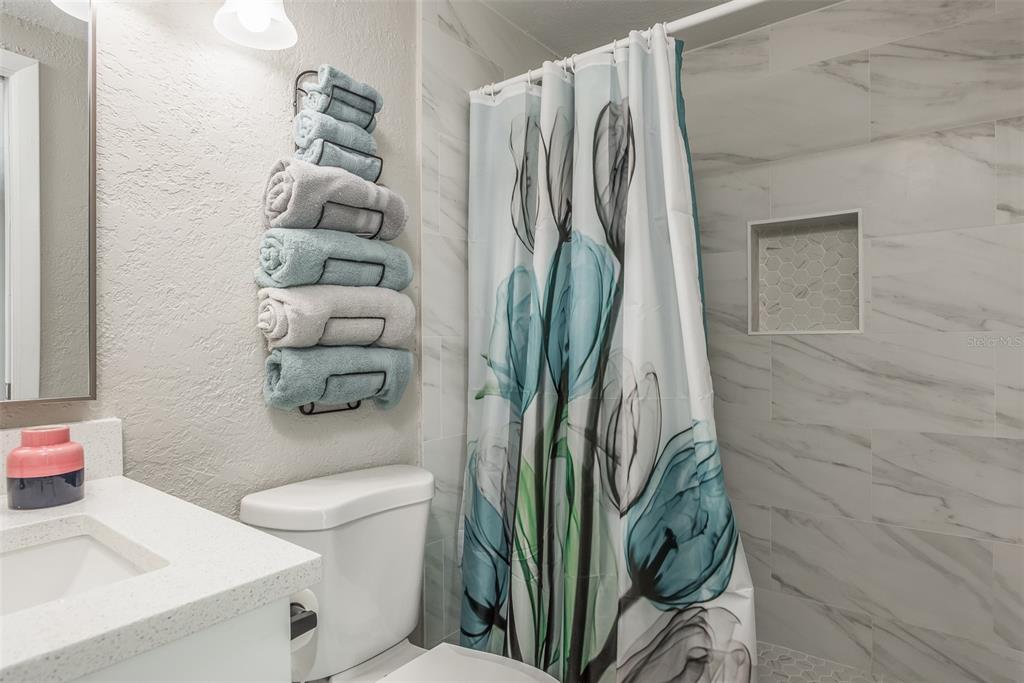 8906 Catalina Drive Port Richey, FL 34668 - Photo 15 of 34 a bathroom with a sink and toilet