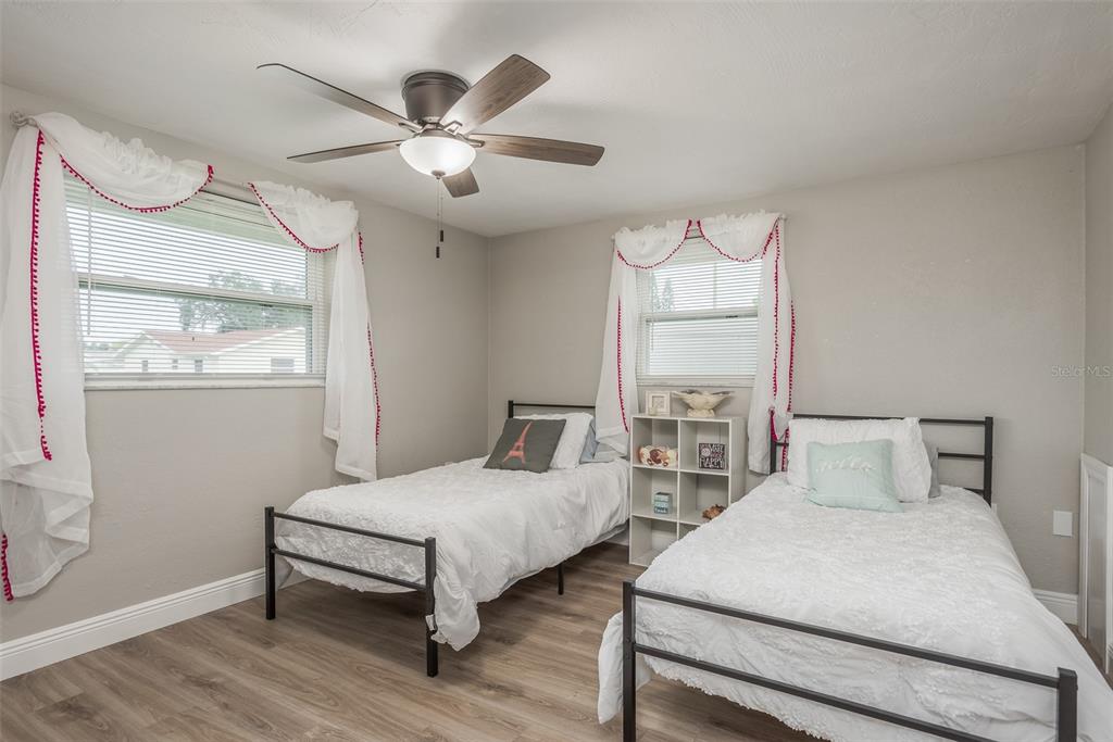 8906 Catalina Drive Port Richey, FL 34668 - Photo 17 of 34 a bedroom with two beds and a table