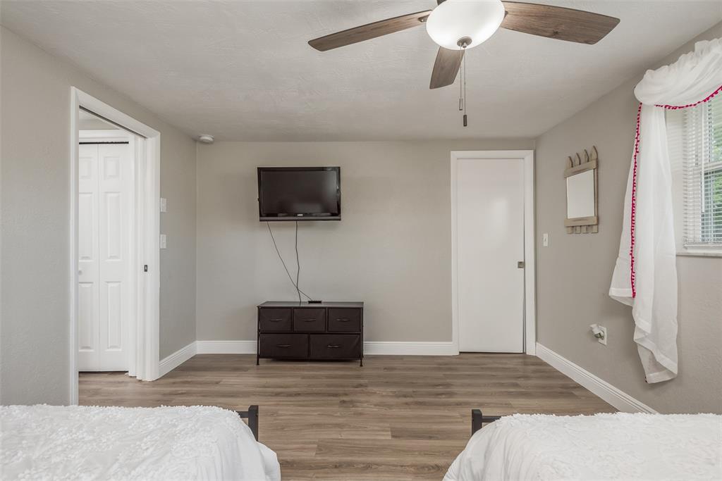 8906 Catalina Drive Port Richey, FL 34668 - Photo 18 of 34 a bedroom with a bed and a flat screen tv