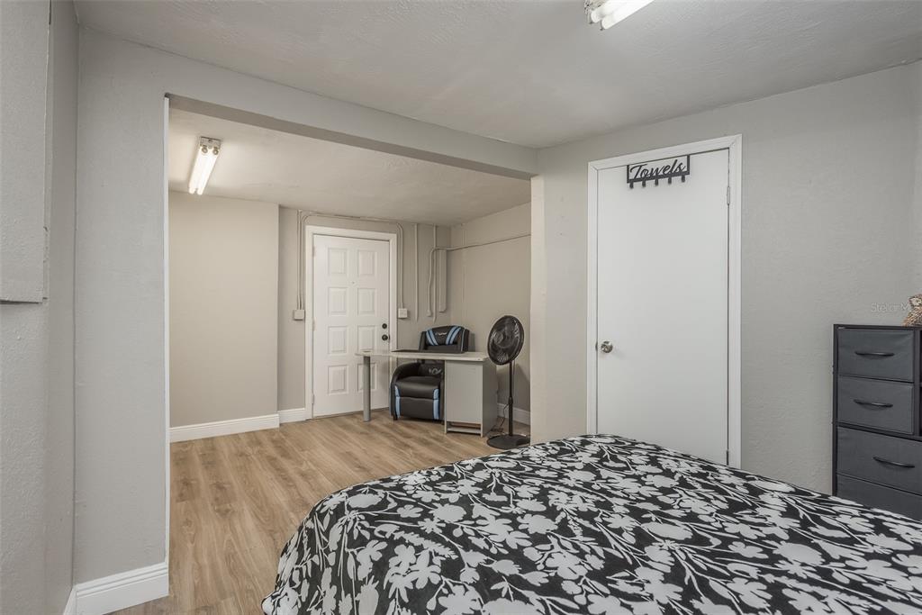 8906 Catalina Drive Port Richey, FL 34668 - Photo 20 of 34 a bedroom with a bed and a dresser