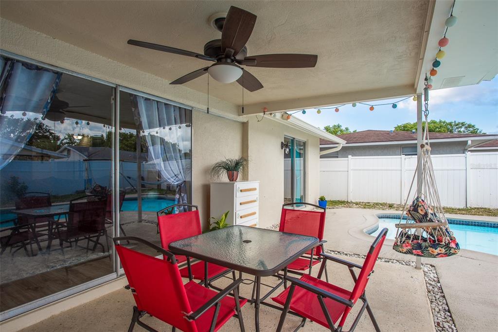 8906 Catalina Drive Port Richey, FL 34668 - Photo 24 of 34 a view of a dining room with furniture window and outside view