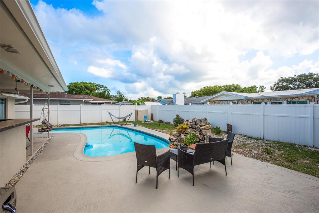8906 Catalina Drive Port Richey, FL 34668 - Photo 33 of 34 a view of a chairs and table in the terrace