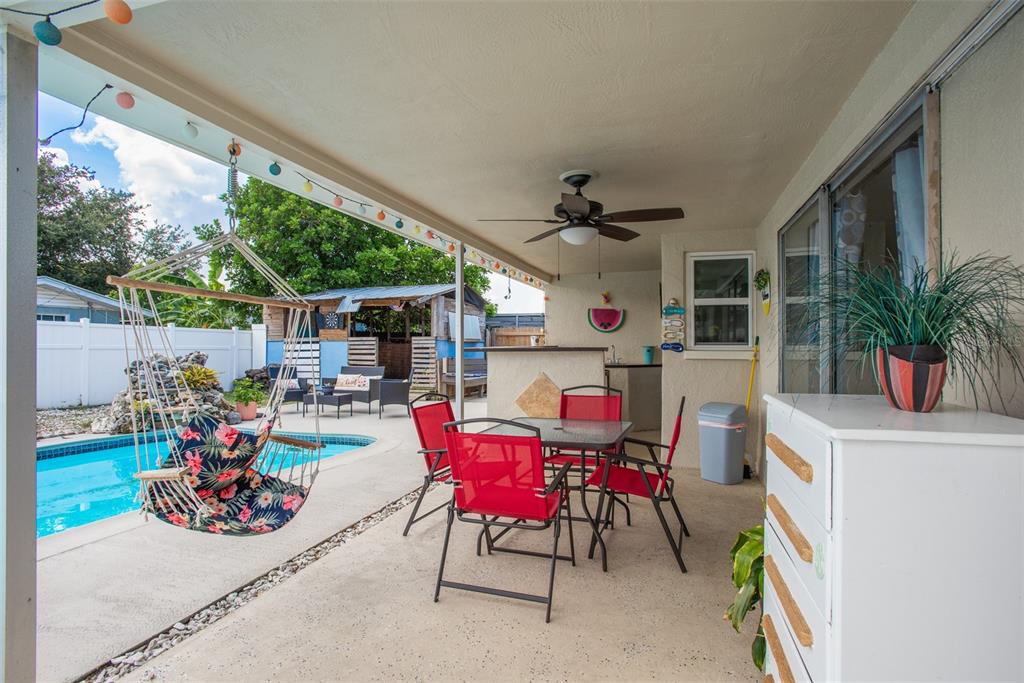 8906 Catalina Drive Port Richey, FL 34668 - Photo 4 of 34 a view of a dining room with furniture window and outside view
