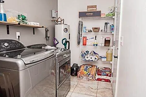 a utility room with multiple dryer and washer